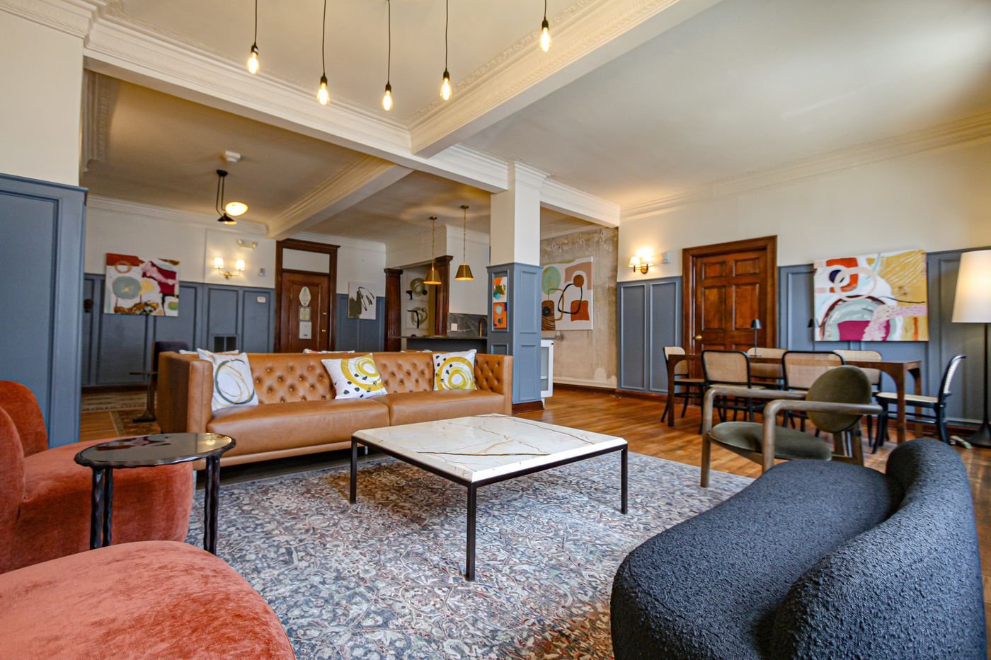 The Addison lobby lounge with leather sofas and blue wainscoting