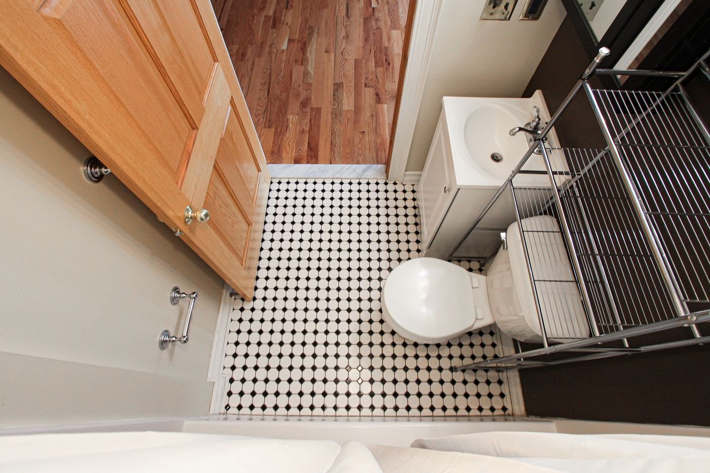 Bath with black and white mosaic floor, from above
