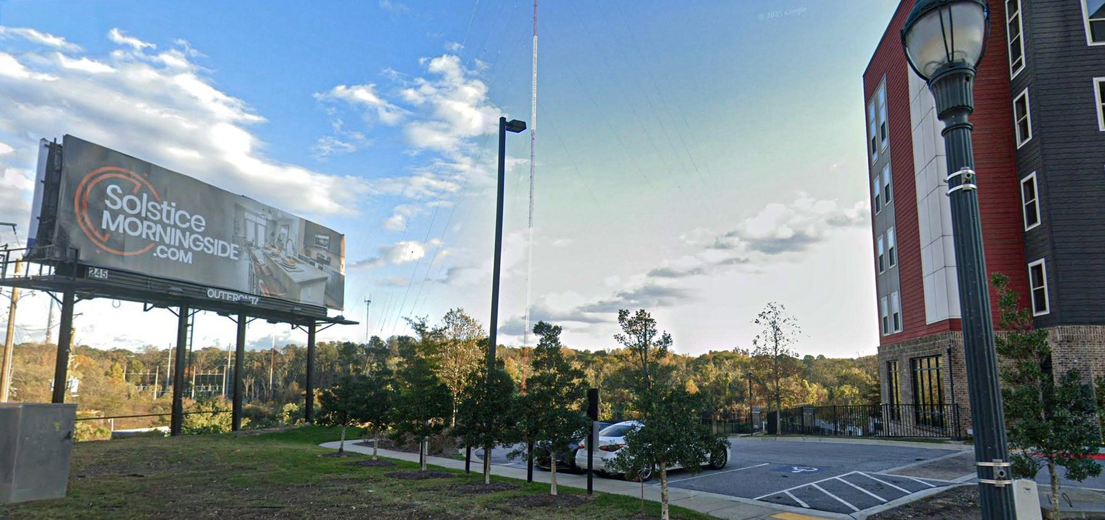 Street view of the installed Solstice Morningside billboard beside the property