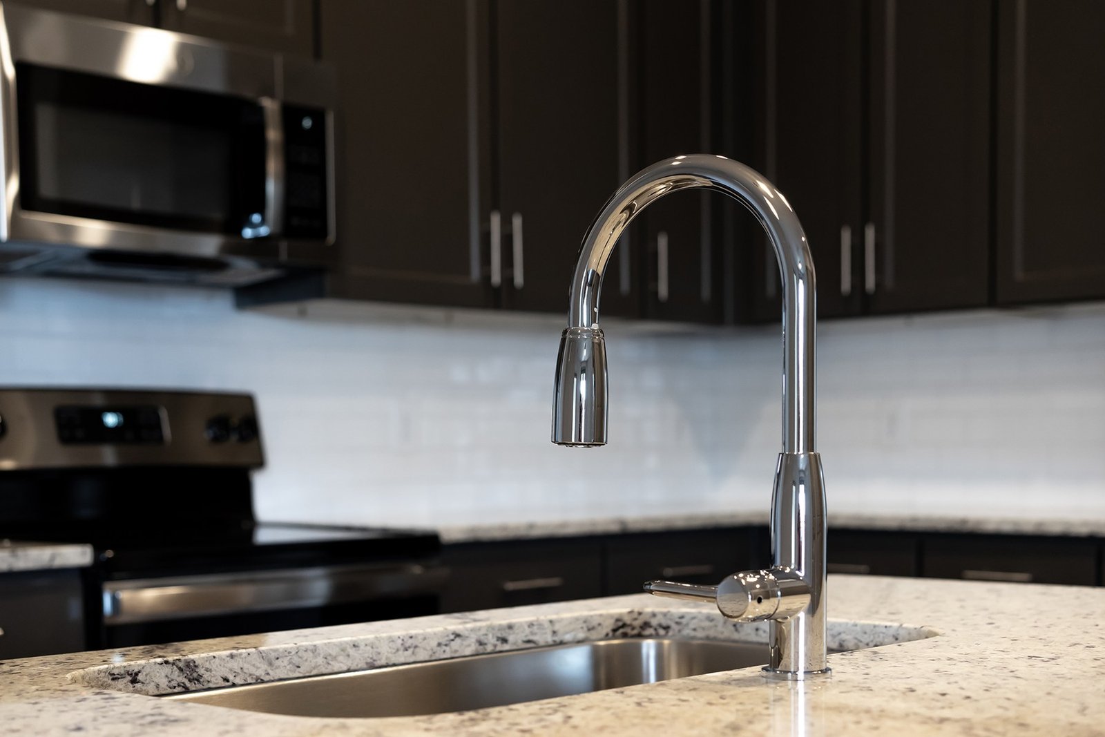 Close view of kitchen faucet and countertop